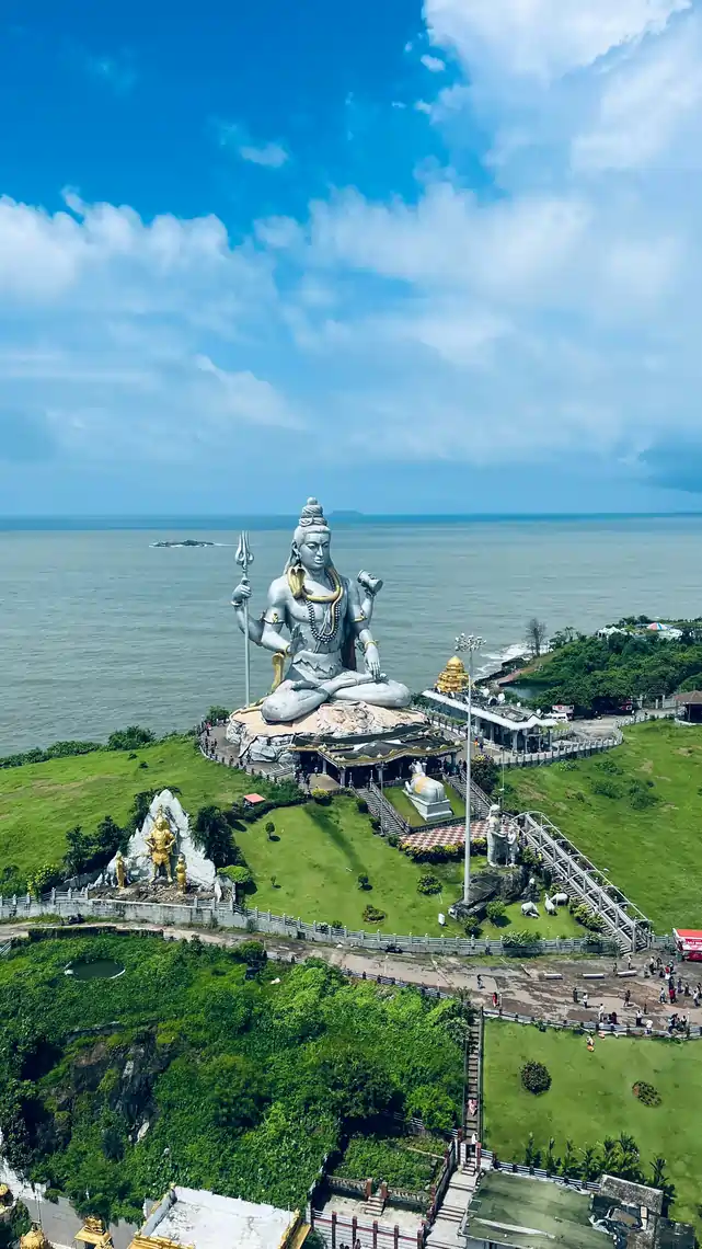 Aerial view of the Murudeshwar Shiva statue on its hill above the coast