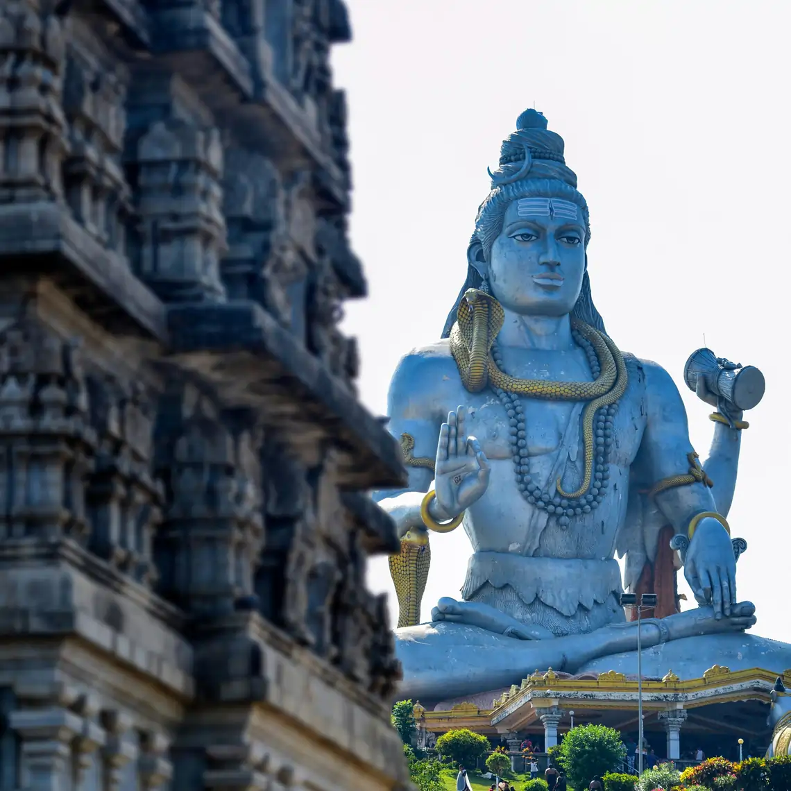Carved Murudeshwar temple tower beside the giant Shiva statue