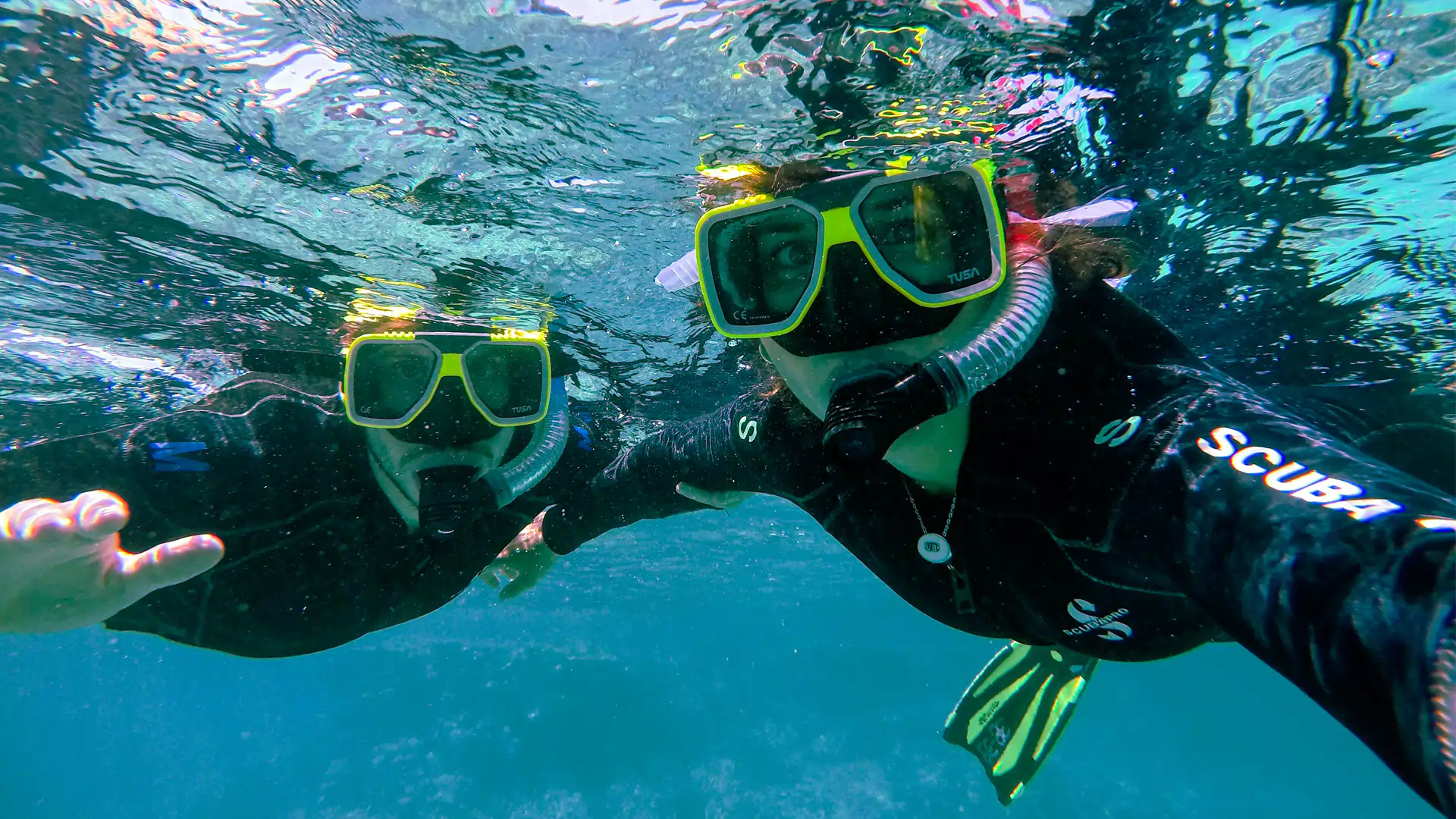 Two scuba divers underwater with Dolphin Dive Murudeshwar near Netrani Island